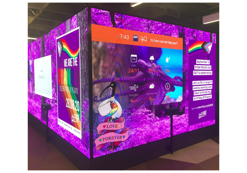 Communication, Wear It Purple Day messages displayed on floor to ceiling digital wall