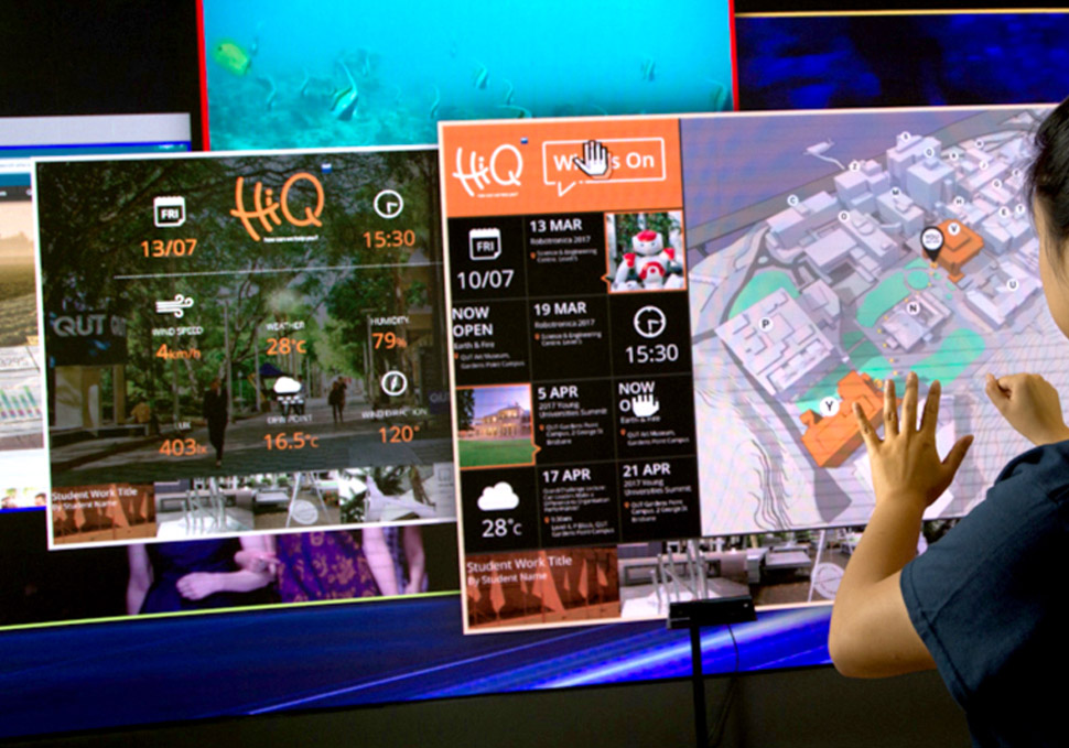 Graphic design, deatil of student interacting with QUT HiQ Gardens Point LED wall with kinect cameras, digital content by Maya Walker