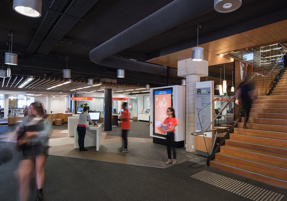 Graphic design, QUT HiQ Kelvin Grove space with students and screens showing content by Maya Walker