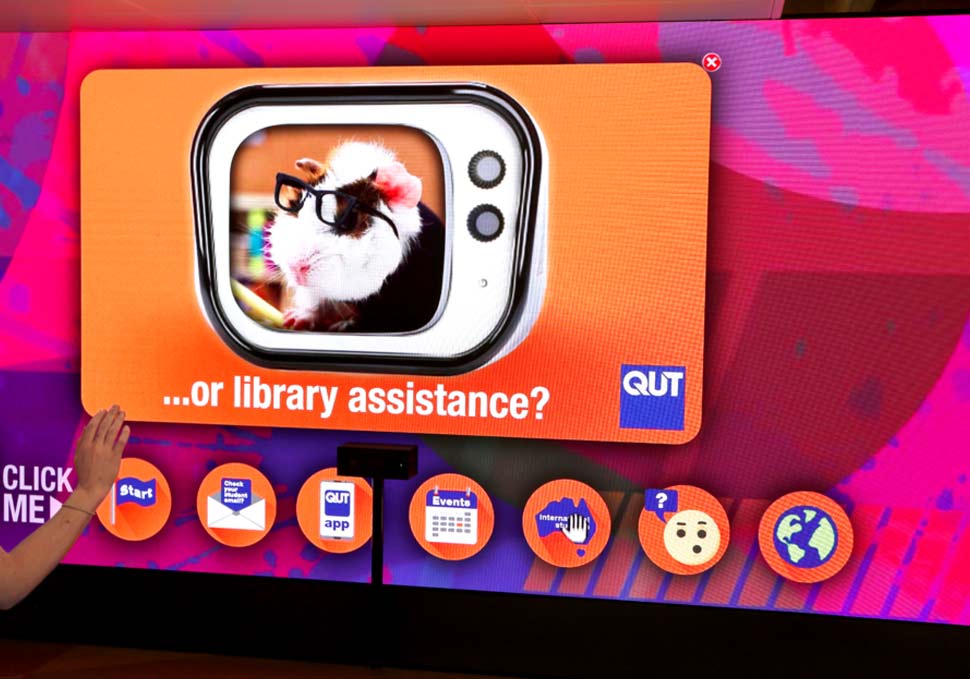 Graphic design, interactive buttons on large LED screen at HiQ Gardens Point QUT, with digital content by Maya Walker